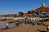 Inle Lake Myanmar. Phaung Daw Oo Paya. Enshrined in the pagoda are five small ancient Buddha images that have been transformed into amorphous blobs by the sheer volume of gold leaf applied by devotees.  